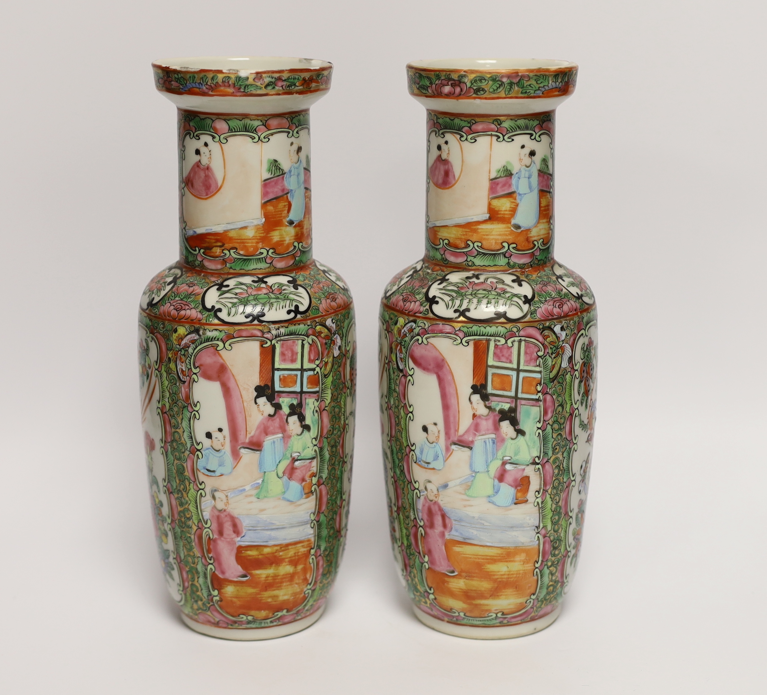 A pair of early 20th century Chinese famille rose vases, 26cm high